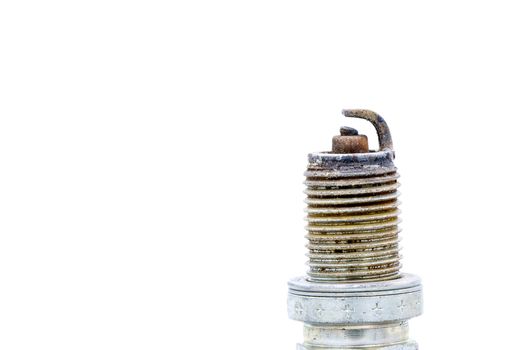 Old spark plug isolated on the white