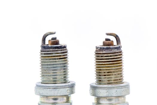 Old spark plug isolated on the white