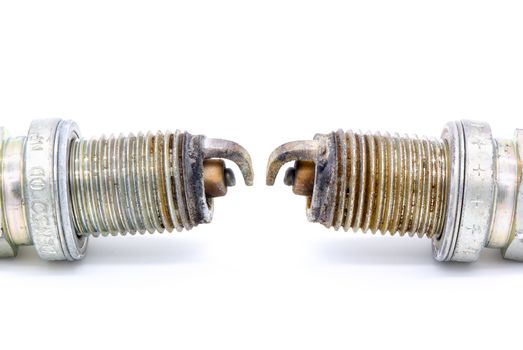 Old spark plug isolated on the white