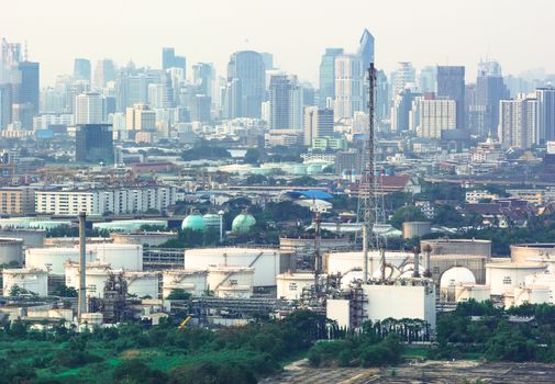 Oil refinery industry And Petrochemical plant with white sky city view