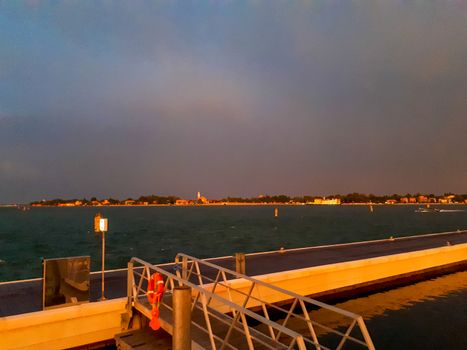 sunset at the pier in venice with the boats