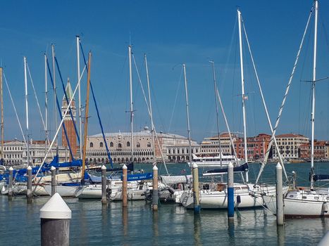 the pier in venice is full with boats