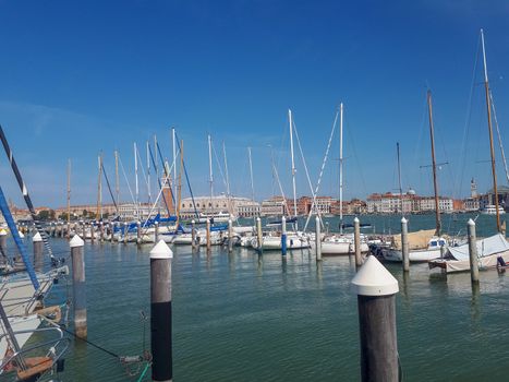 the pier in venice is full with boats