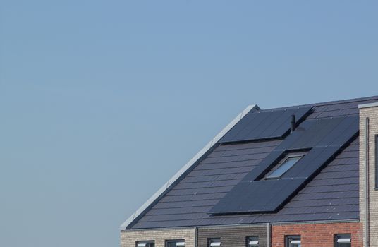 Solar panels on the roof of a house / photovoltaics on domestic home