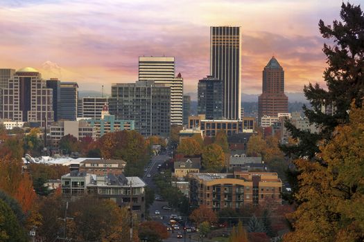 Portland Oregon downtown cityscape with Mount Hood during colorful sunrise in Fall season