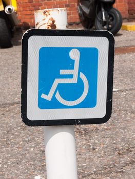 disabled parking sign on post a train station; Essex; UK