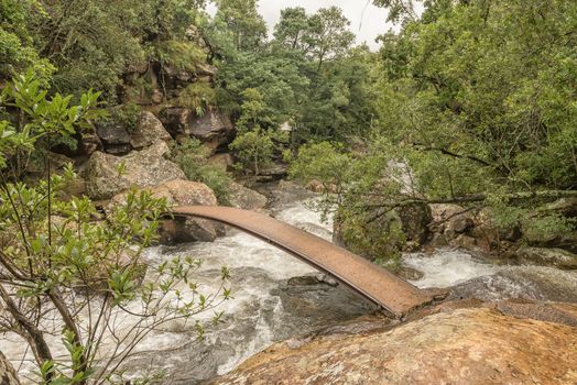 A pedestrian bridge on the trail to the Cascades in the Mahai River in the Kwazulu-Natal Drakensberg