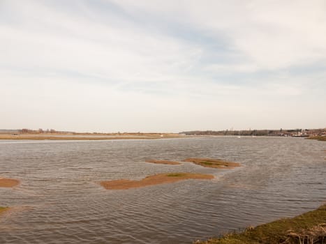 large bay of water manningtree sky blue spring day coast; essex; england; uk