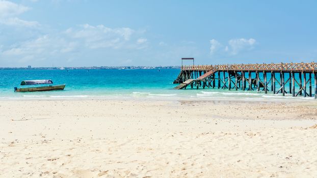 Wooden pier at Prison island near Zanzibar,  Beautiful turquoise water and white sand near Zanzibar, Tanzania