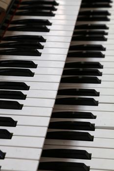 Close up old vintage manual double keyboard (bank of keys) of church organ, high angle view