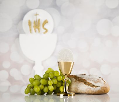 Holy communion a golden chalice, composition isolated on white