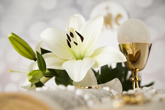 Holy communion a golden chalice with grapes and bread wafers