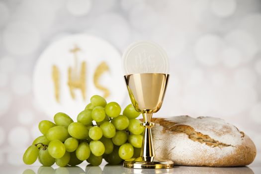 Holy communion a golden chalice, composition isolated on white