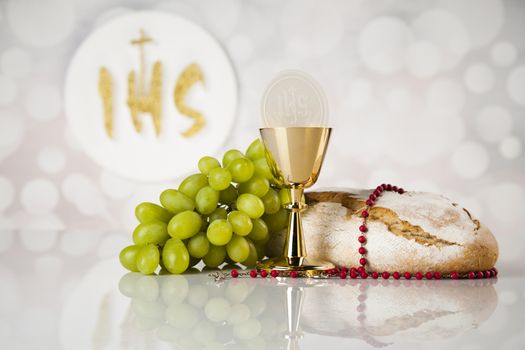 Holy communion a golden chalice, composition isolated on white