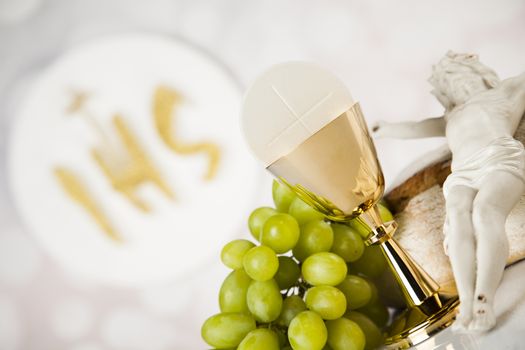 Holy communion a golden chalice, composition isolated on white