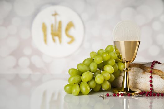 Holy communion a golden chalice, composition isolated on white