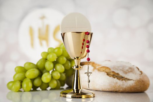Holy communion a golden chalice, composition isolated on white