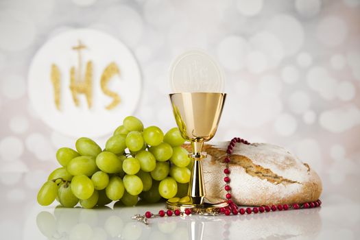 Holy communion a golden chalice, composition isolated on white