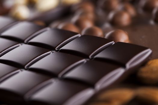 Dark and milk chocolate bar on a wooden table