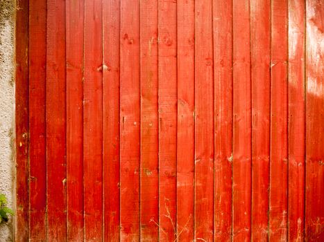 texture and pattern of red wooden garden fence; Essex; UK