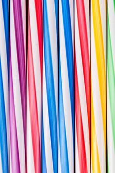 Background stripes multicolored smoothies plastic cocktail straws