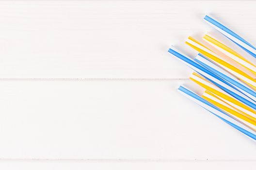 Multicolor cocktail tubes on white background. Close up
