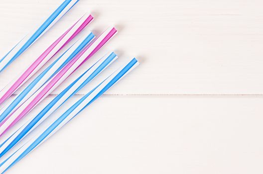 Multicolor cocktail tubes on white background. Close up