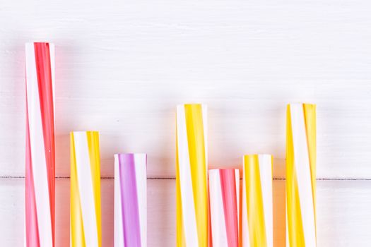 Multicolor cocktail tubes on white background. Close up