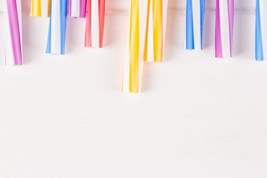 Multicolor cocktail tubes on white background. Close up