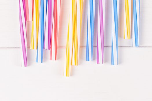 Multicolor cocktail tubes on white background. Close up