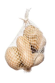 bunch fresh potatoes in a white mesh bag