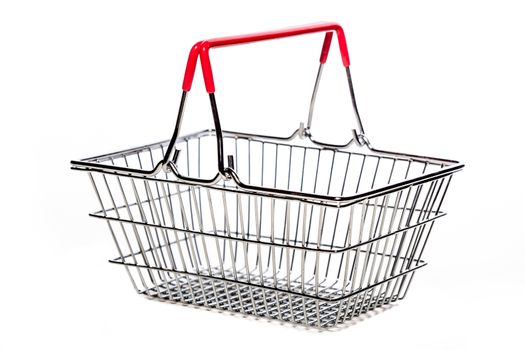 tiny metal shopping basket against white background