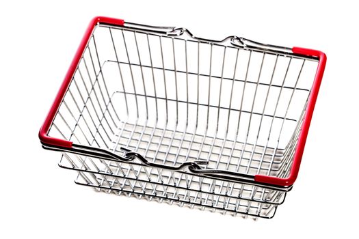 tiny metal shopping basket against white background