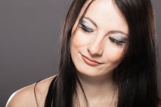 studio portrait of a beautiful brunette girl