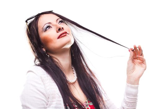 beautiful girl playing with her hair and looking up