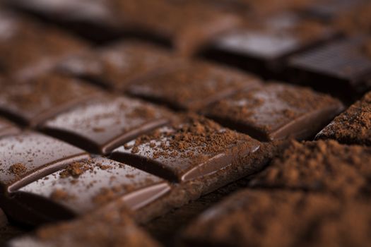 Aromatic cocoa and chocolate on wooden background