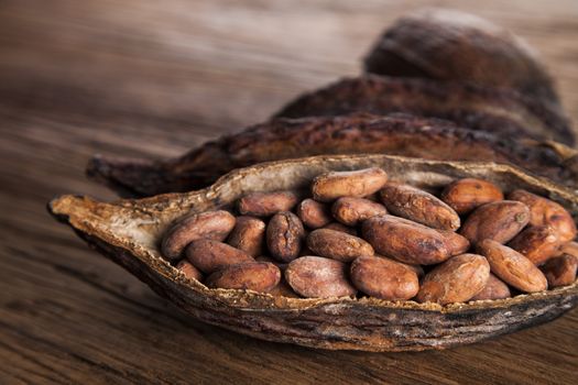 Cocoa pod on wooden background