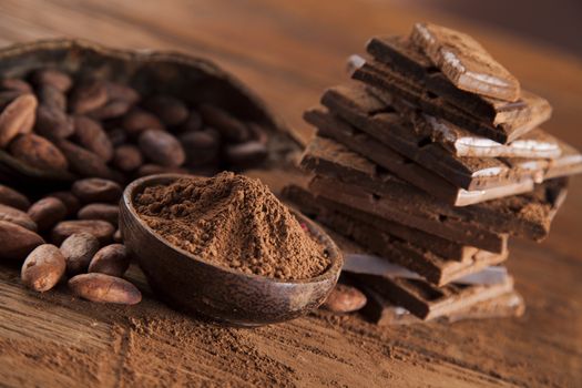 Dark and milk chocolate bar on a wooden table