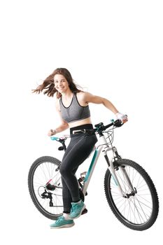 girl posing with her mountainbike against white background
