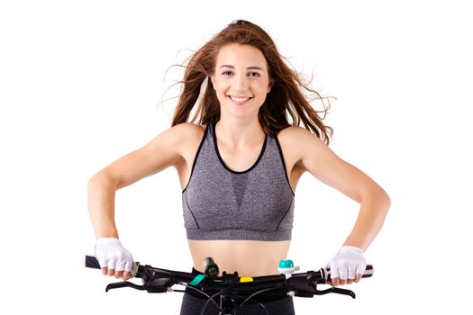 girl posing with her mountainbike against white background