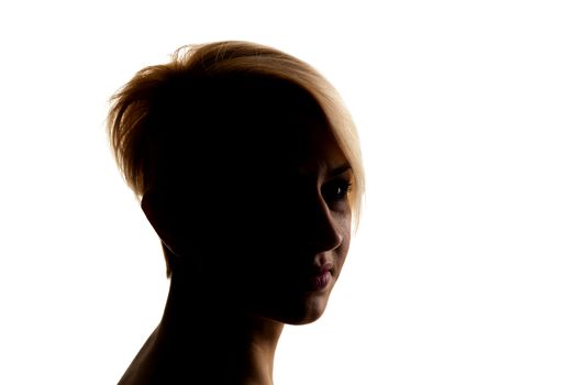 silhouette portrait of a beautiful caucasian girl with short hair