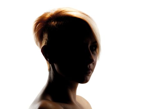 silhouette portrait of a beautiful caucasian girl with short hair