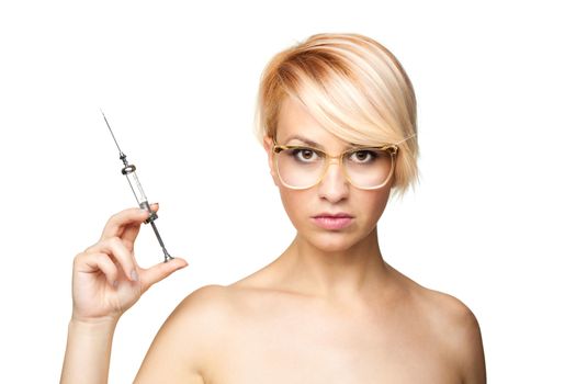 blond nurse with glasses holding a vintage metal syringe