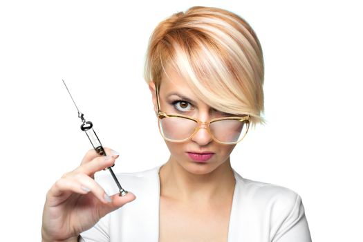 blond nurse with glasses holding a vintage metal syringe