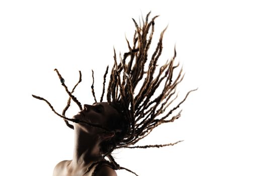 portrait of a caucasian girl with dreadlocks flying in the air