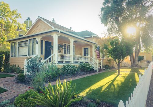 Perfect American Suburban White Picket Fence Home With Veranda And Flag