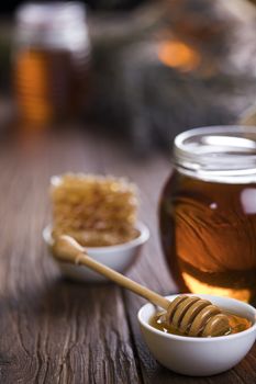 Jar full of fresh honey and honeycombs