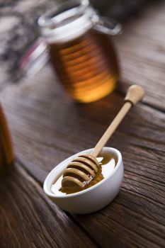 Fresh honey on wooden table