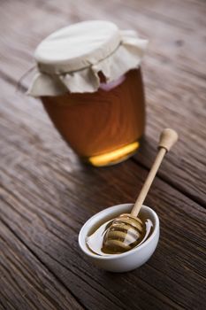 Fresh honey on wooden table