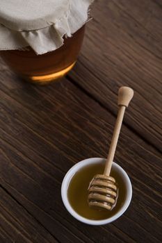 Fresh honey on wooden table